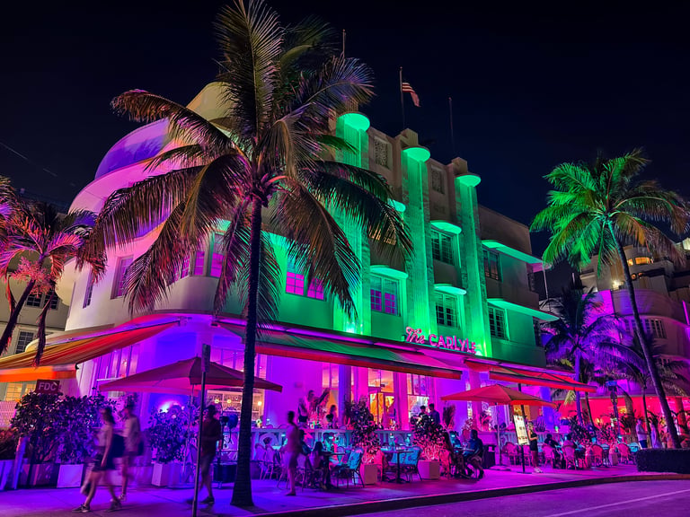 Miami Beach, Florida - July 8, 2024: Vibrant night scene of The Carlyle at Ocean Drive, South Beach