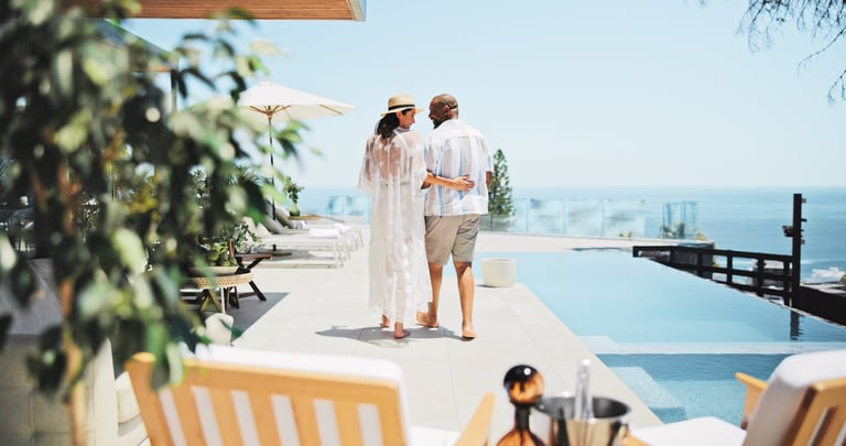 Back, swimming pool and couple with vacation, view and bonding together with honeymoon