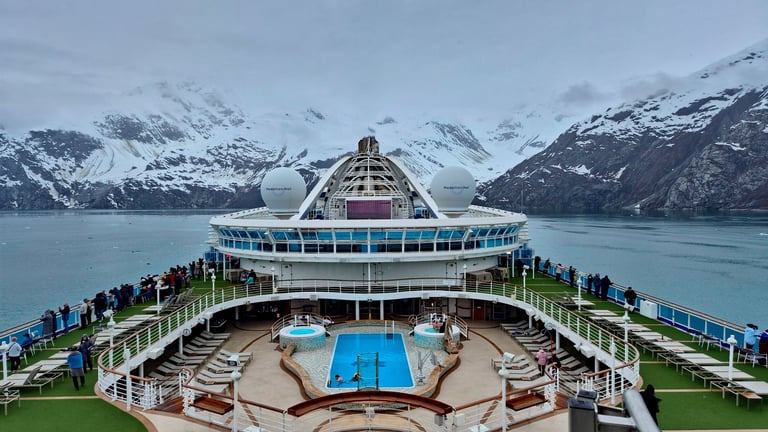 Alaska, USA - Tourists on a cruise ship admire glaciers at Glacier Bay National Park and Preserve